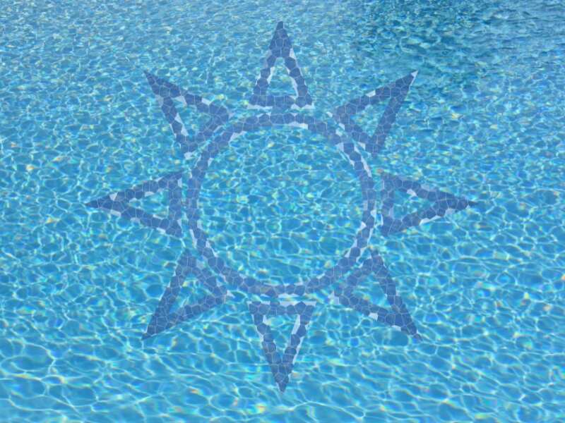 A top-down view of a pool with a sun-shaped design on the floor